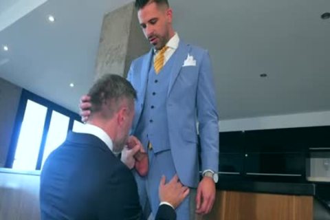 Wearing suit enjoys hard pounding